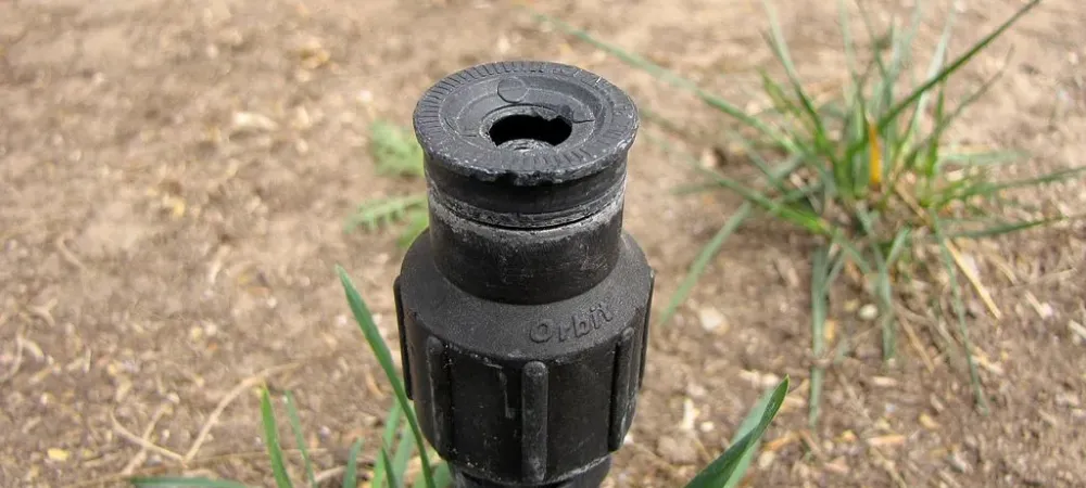 A broken lawn sprinkler in need of repair